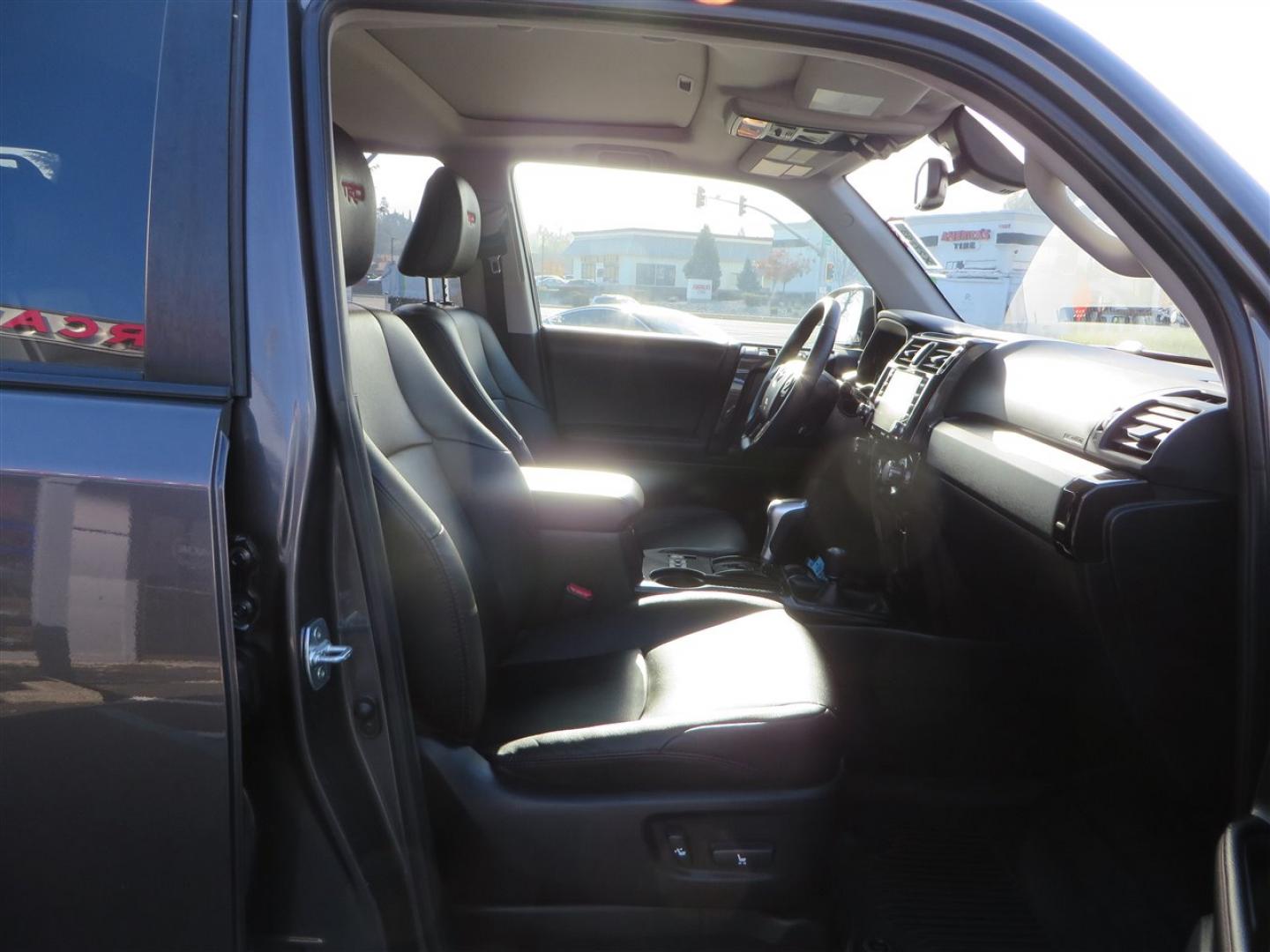 2021 grey /black Toyota 4Runner TRD Off-road Premium 4WD (JTERU5JR3M5) with an 4.0L V6 DOHC 24V engine, 5A transmission, located at 2630 Grass Valley Highway, Auburn, CA, 95603, (530) 508-5100, 38.937893, -121.095482 - Featuring Icon suspension, C4 front bumper, Victory 4x4 rear bumper with spare tire carrier, C4 ladder, Victory 4x4 roof rack, Victory 4x4 rock sliders, Baja designs LED's, 17'' KMC wheels, Maxxis Razr AT tires, and a Victory 4x4 rear cargo Molle panel. - Photo#57