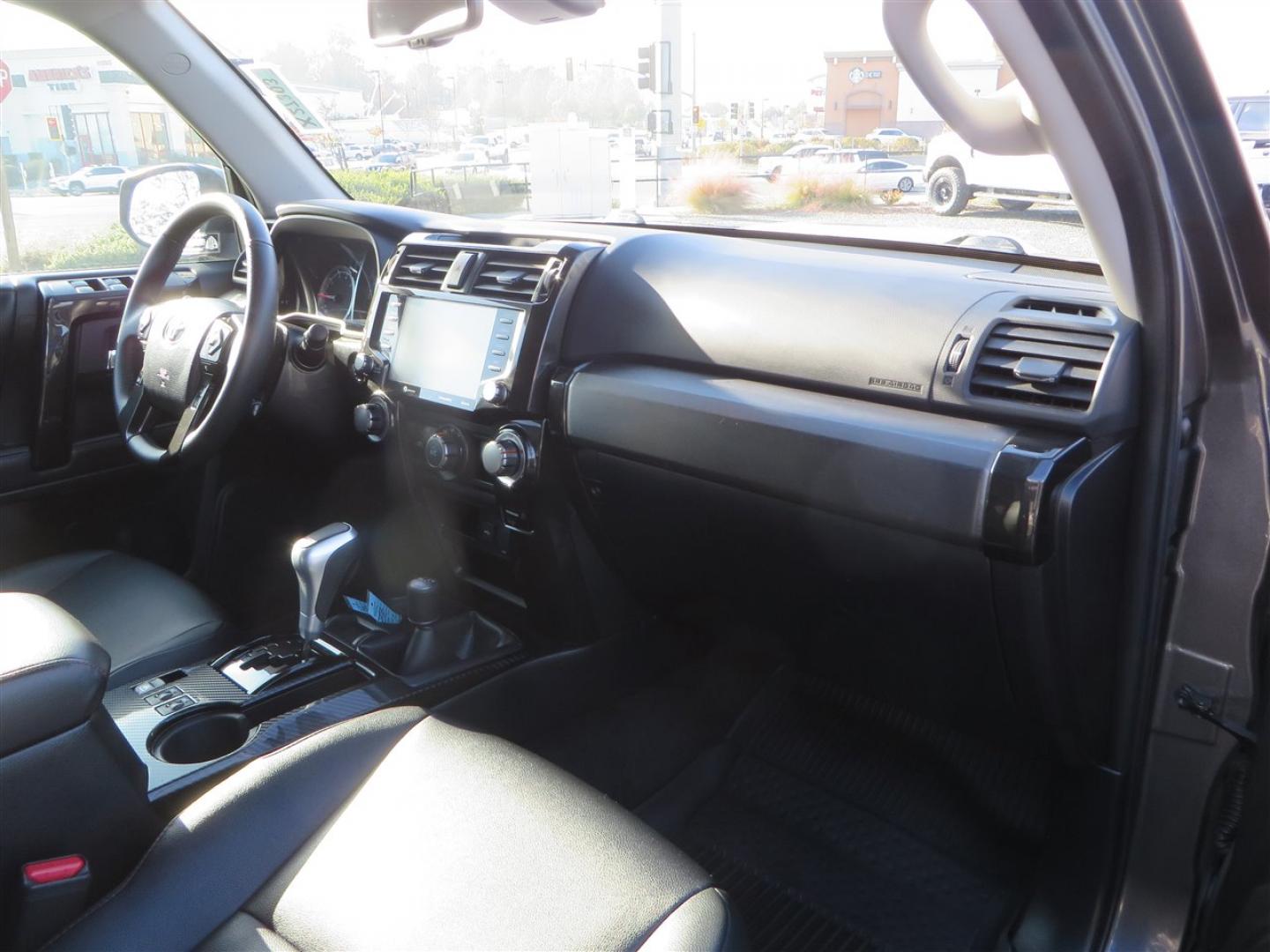 2021 grey /black Toyota 4Runner TRD Off-road Premium 4WD (JTERU5JR3M5) with an 4.0L V6 DOHC 24V engine, 5A transmission, located at 2630 Grass Valley Highway, Auburn, CA, 95603, (530) 508-5100, 38.937893, -121.095482 - Featuring Icon suspension, C4 front bumper, Victory 4x4 rear bumper with spare tire carrier, C4 ladder, Victory 4x4 roof rack, Victory 4x4 rock sliders, Baja designs LED's, 17'' KMC wheels, Maxxis Razr AT tires, and a Victory 4x4 rear cargo Molle panel. - Photo#60