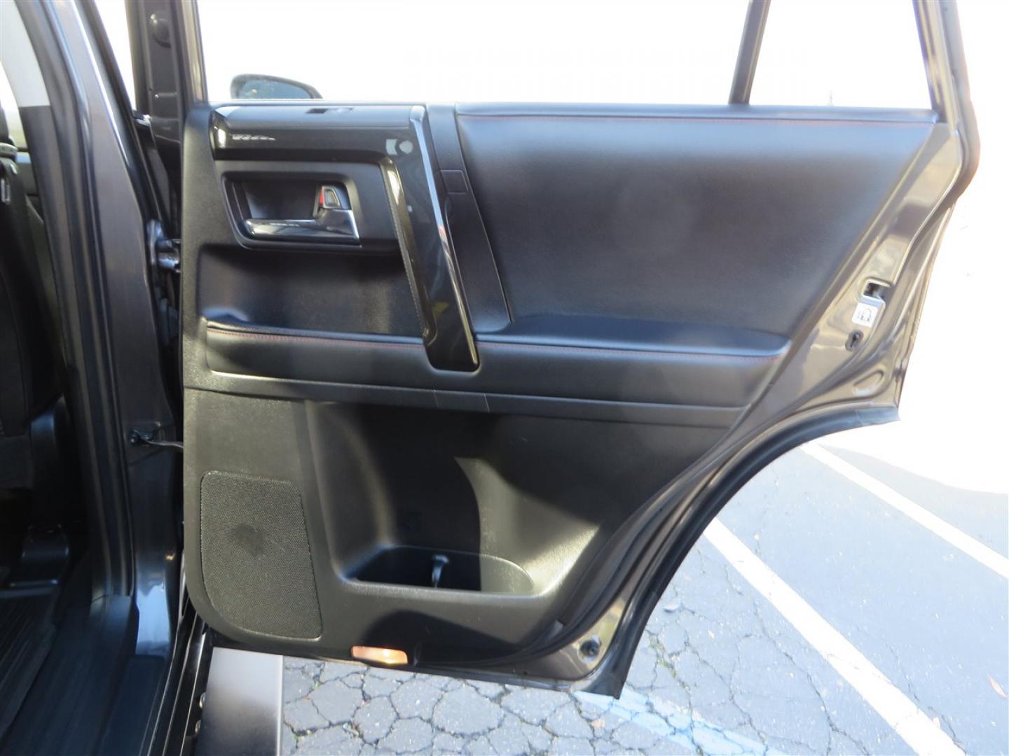 2021 grey /black Toyota 4Runner TRD Off-road Premium 4WD (JTERU5JR3M5) with an 4.0L V6 DOHC 24V engine, 5A transmission, located at 2630 Grass Valley Highway, Auburn, CA, 95603, (530) 508-5100, 38.937893, -121.095482 - Featuring Icon suspension, C4 front bumper, Victory 4x4 rear bumper with spare tire carrier, C4 ladder, Victory 4x4 roof rack, Victory 4x4 rock sliders, Baja designs LED's, 17'' KMC wheels, Maxxis Razr AT tires, and a Victory 4x4 rear cargo Molle panel. - Photo#62