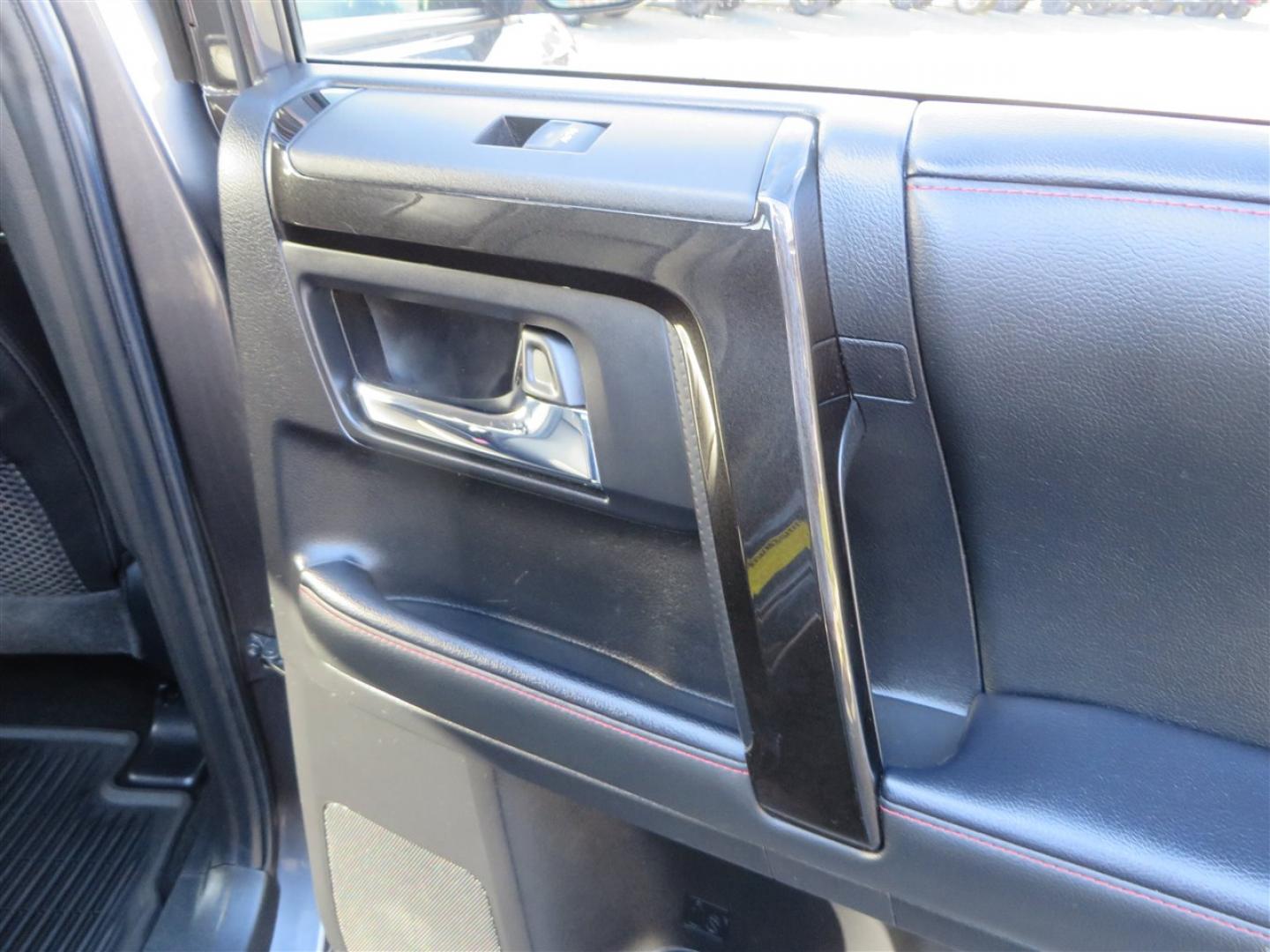 2021 grey /black Toyota 4Runner TRD Off-road Premium 4WD (JTERU5JR3M5) with an 4.0L V6 DOHC 24V engine, 5A transmission, located at 2630 Grass Valley Highway, Auburn, CA, 95603, (530) 508-5100, 38.937893, -121.095482 - Featuring Icon suspension, C4 front bumper, Victory 4x4 rear bumper with spare tire carrier, C4 ladder, Victory 4x4 roof rack, Victory 4x4 rock sliders, Baja designs LED's, 17'' KMC wheels, Maxxis Razr AT tires, and a Victory 4x4 rear cargo Molle panel. - Photo#63