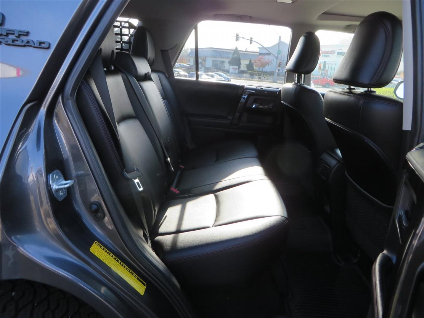 2021 grey /black Toyota 4Runner TRD Off-road Premium 4WD (JTERU5JR3M5) with an 4.0L V6 DOHC 24V engine, 5A transmission, located at 2630 Grass Valley Highway, Auburn, CA, 95603, (530) 508-5100, 38.937893, -121.095482 - Featuring Icon suspension, C4 front bumper, Victory 4x4 rear bumper with spare tire carrier, C4 ladder, Victory 4x4 roof rack, Victory 4x4 rock sliders, Baja designs LED's, 17'' KMC wheels, Maxxis Razr AT tires, and a Victory 4x4 rear cargo Molle panel. - Photo#64