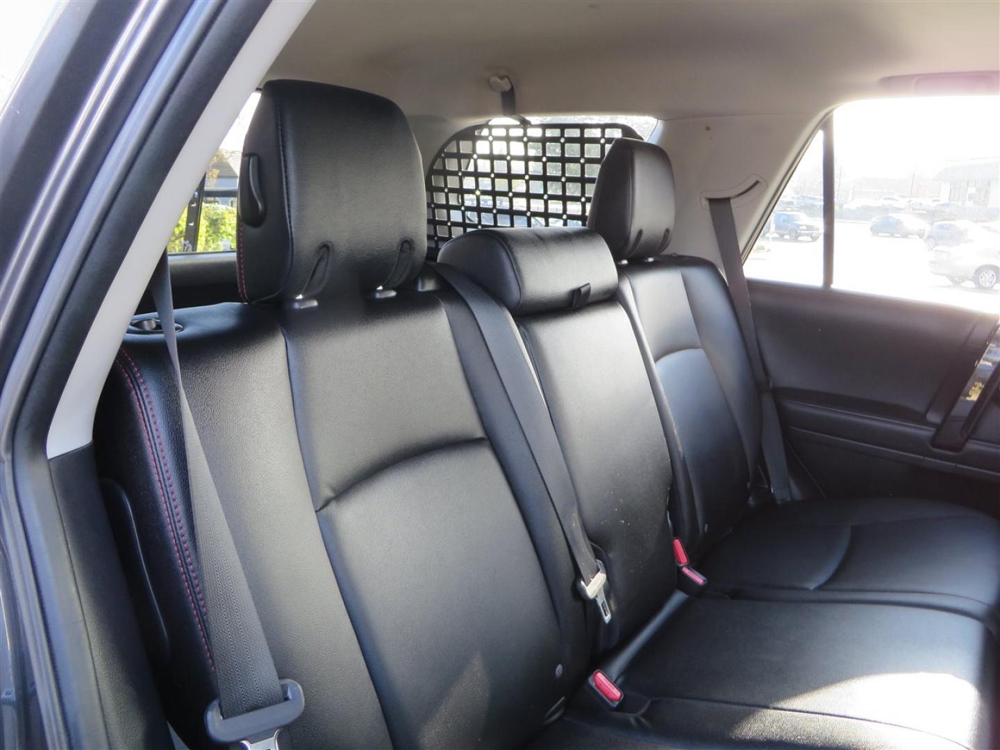 2021 grey /black Toyota 4Runner TRD Off-road Premium 4WD (JTERU5JR3M5) with an 4.0L V6 DOHC 24V engine, 5A transmission, located at 2630 Grass Valley Highway, Auburn, CA, 95603, (530) 508-5100, 38.937893, -121.095482 - Featuring Icon suspension, C4 front bumper, Victory 4x4 rear bumper with spare tire carrier, C4 ladder, Victory 4x4 roof rack, Victory 4x4 rock sliders, Baja designs LED's, 17'' KMC wheels, Maxxis Razr AT tires, and a Victory 4x4 rear cargo Molle panel. - Photo#65