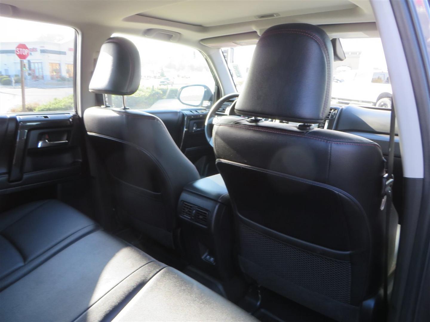 2021 grey /black Toyota 4Runner TRD Off-road Premium 4WD (JTERU5JR3M5) with an 4.0L V6 DOHC 24V engine, 5A transmission, located at 2630 Grass Valley Highway, Auburn, CA, 95603, (530) 508-5100, 38.937893, -121.095482 - Featuring Icon suspension, C4 front bumper, Victory 4x4 rear bumper with spare tire carrier, C4 ladder, Victory 4x4 roof rack, Victory 4x4 rock sliders, Baja designs LED's, 17'' KMC wheels, Maxxis Razr AT tires, and a Victory 4x4 rear cargo Molle panel. - Photo#66