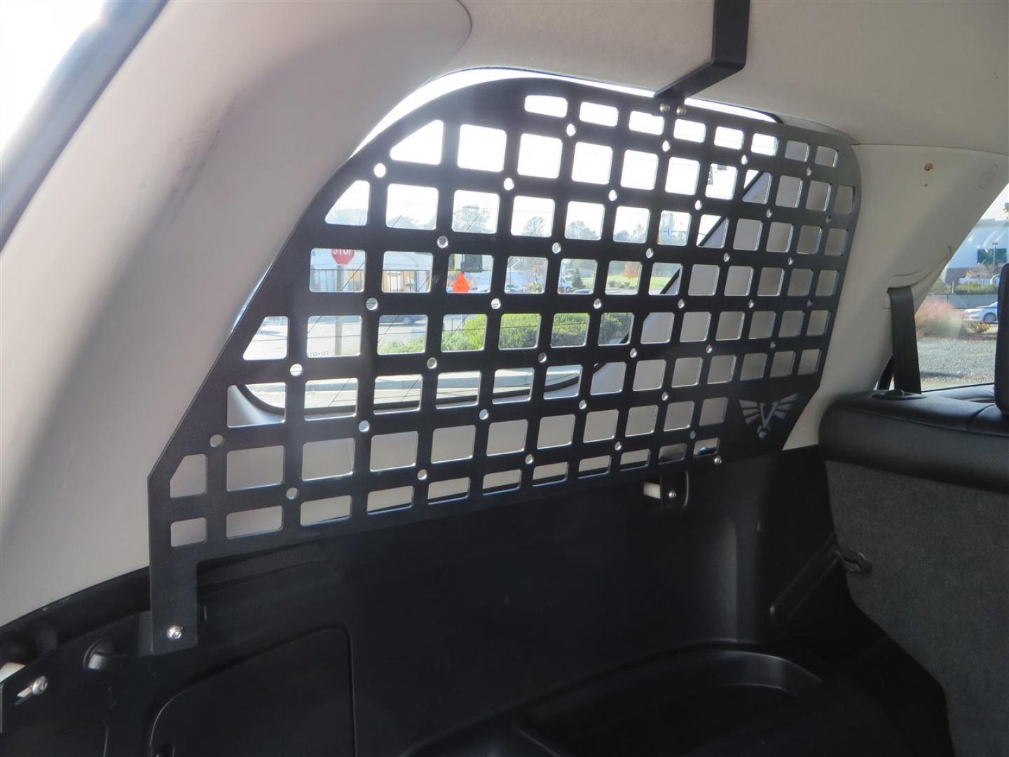 2021 grey /black Toyota 4Runner TRD Off-road Premium 4WD (JTERU5JR3M5) with an 4.0L V6 DOHC 24V engine, 5A transmission, located at 2630 Grass Valley Highway, Auburn, CA, 95603, (530) 508-5100, 38.937893, -121.095482 - Featuring Icon suspension, C4 front bumper, Victory 4x4 rear bumper with spare tire carrier, C4 ladder, Victory 4x4 roof rack, Victory 4x4 rock sliders, Baja designs LED's, 17'' KMC wheels, Maxxis Razr AT tires, and a Victory 4x4 rear cargo Molle panel. - Photo#70