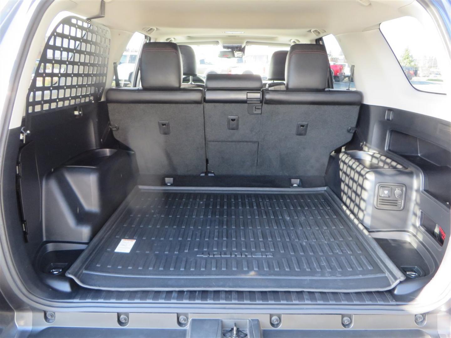 2021 grey /black Toyota 4Runner TRD Off-road Premium 4WD (JTERU5JR3M5) with an 4.0L V6 DOHC 24V engine, 5A transmission, located at 2630 Grass Valley Highway, Auburn, CA, 95603, (530) 508-5100, 38.937893, -121.095482 - Featuring Icon suspension, C4 front bumper, Victory 4x4 rear bumper with spare tire carrier, C4 ladder, Victory 4x4 roof rack, Victory 4x4 rock sliders, Baja designs LED's, 17'' KMC wheels, Maxxis Razr AT tires, and a Victory 4x4 rear cargo Molle panel. - Photo#69