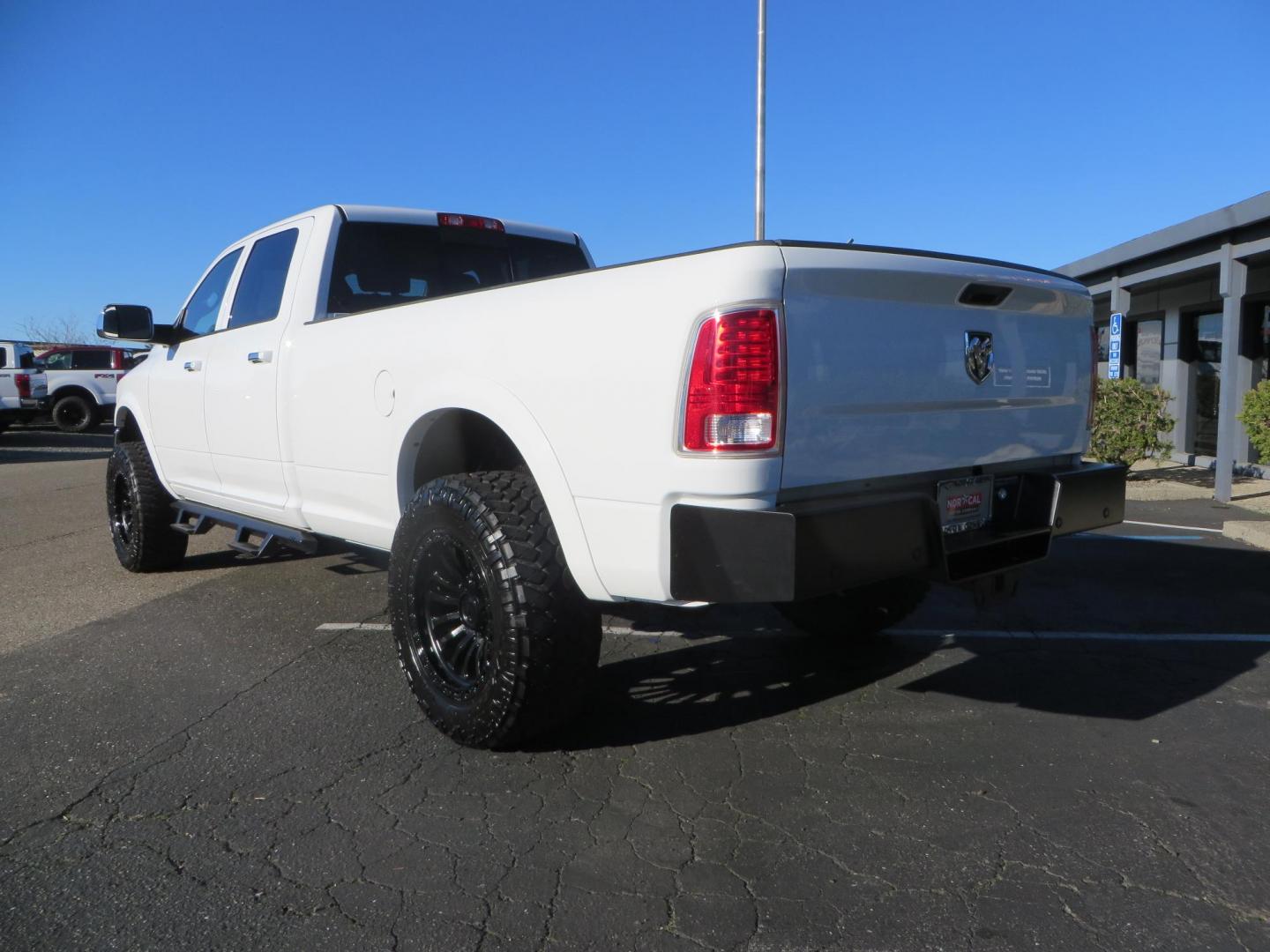 2015 White /Tan RAM 2500 Laramie Crew Cab LWB 4WD (3C6UR5KLXFG) with an 6.7L L6 OHV 24V TURBO DIESEL engine, 6-Speed Automatic transmission, located at 2630 Grass Valley Highway, Auburn, CA, 95603, (530) 508-5100, 38.937893, -121.095482 - Features- Thuren Suspension system, Fox 2.5 Performance Elite shocks, N-Fab runnign boards, Rimrock rear bumper, 20'' Fuel wheels, 35'' Nito Trail Grappler tires, Weathertech floor liners, and a Banks intake. - Photo#2
