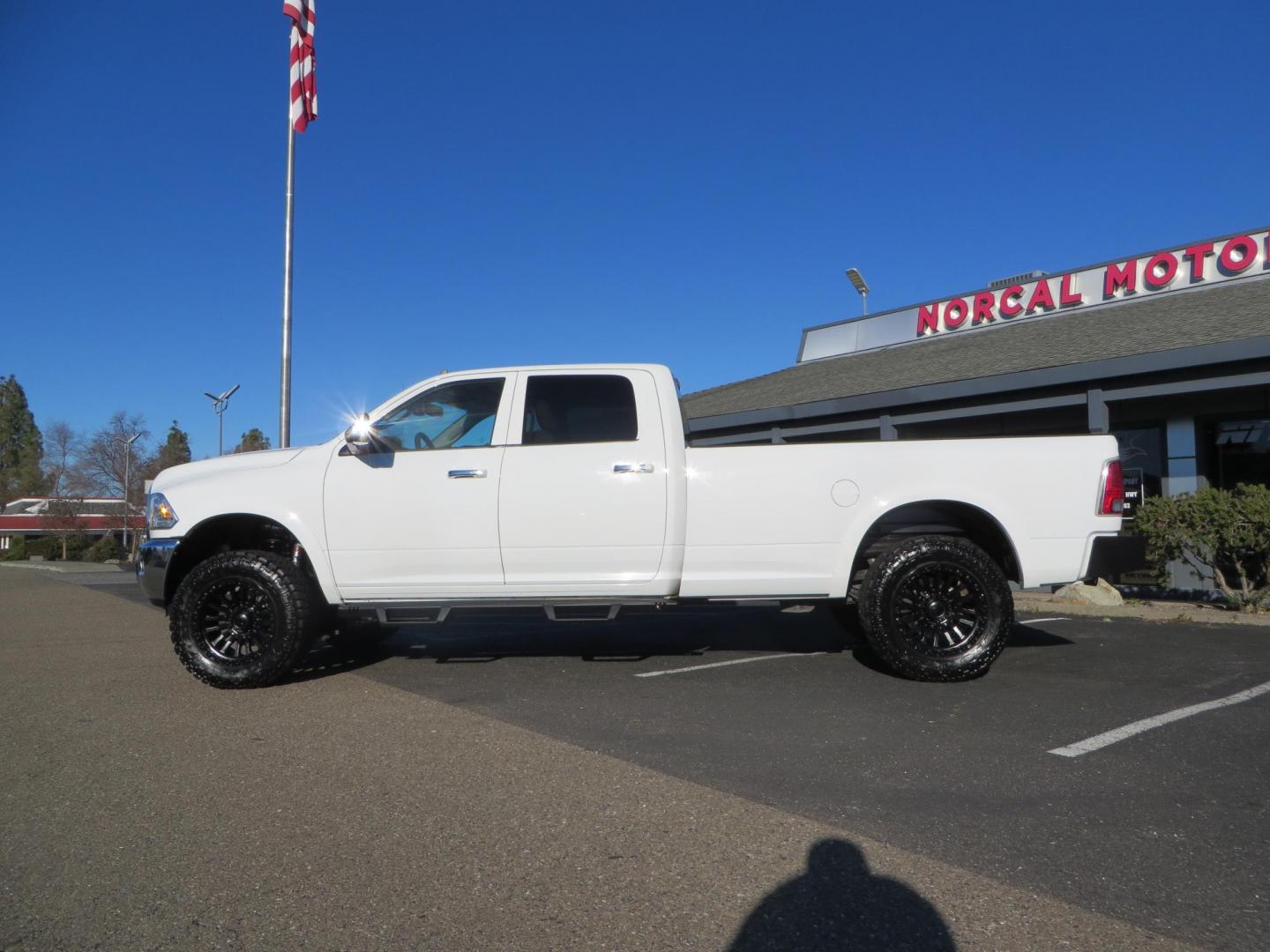 2015 White /Tan RAM 2500 Laramie Crew Cab LWB 4WD (3C6UR5KLXFG) with an 6.7L L6 OHV 24V TURBO DIESEL engine, 6-Speed Automatic transmission, located at 2630 Grass Valley Highway, Auburn, CA, 95603, (530) 508-5100, 38.937893, -121.095482 - Features- Thuren Suspension system, Fox 2.5 Performance Elite shocks, N-Fab runnign boards, Rimrock rear bumper, 20'' Fuel wheels, 35'' Nito Trail Grappler tires, Weathertech floor liners, and a Banks intake. - Photo#1