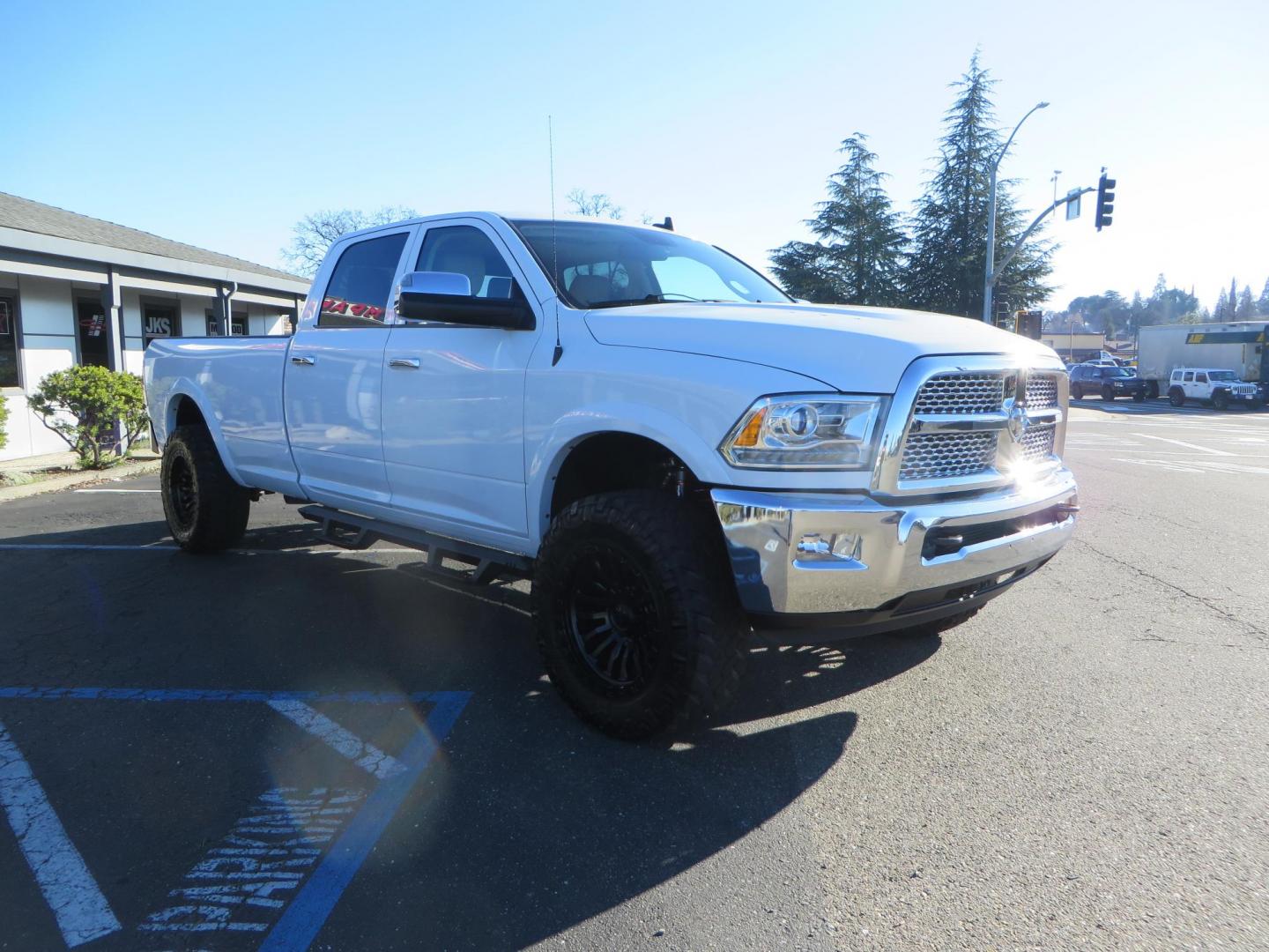 2015 White /Tan RAM 2500 Laramie Crew Cab LWB 4WD (3C6UR5KLXFG) with an 6.7L L6 OHV 24V TURBO DIESEL engine, 6-Speed Automatic transmission, located at 2630 Grass Valley Highway, Auburn, CA, 95603, (530) 508-5100, 38.937893, -121.095482 - Features- Thuren Suspension system, Fox 2.5 Performance Elite shocks, N-Fab runnign boards, Rimrock rear bumper, 20'' Fuel wheels, 35'' Nito Trail Grappler tires, Weathertech floor liners, and a Banks intake. - Photo#5