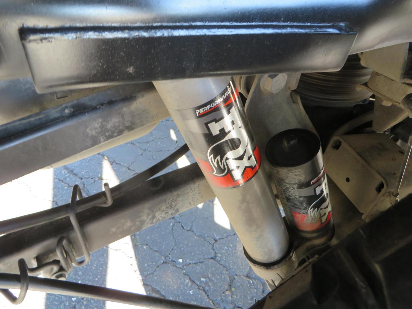 2015 White /Tan RAM 2500 Laramie Crew Cab LWB 4WD (3C6UR5KLXFG) with an 6.7L L6 OHV 24V TURBO DIESEL engine, 6-Speed Automatic transmission, located at 2630 Grass Valley Highway, Auburn, CA, 95603, (530) 508-5100, 38.937893, -121.095482 - Features- Thuren Suspension system, Fox 2.5 Performance Elite shocks, N-Fab runnign boards, Rimrock rear bumper, 20'' Fuel wheels, 35'' Nito Trail Grappler tires, Weathertech floor liners, and a Banks intake. - Photo#13