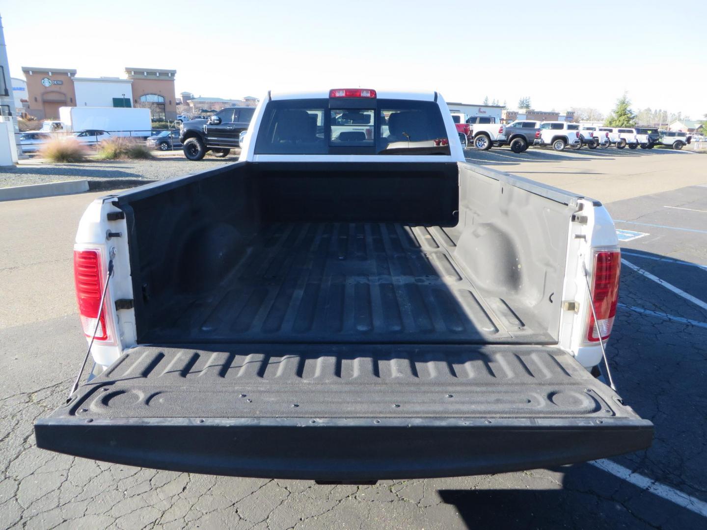 2015 White /Tan RAM 2500 Laramie Crew Cab LWB 4WD (3C6UR5KLXFG) with an 6.7L L6 OHV 24V TURBO DIESEL engine, 6-Speed Automatic transmission, located at 2630 Grass Valley Highway, Auburn, CA, 95603, (530) 508-5100, 38.937893, -121.095482 - Features- Thuren Suspension system, Fox 2.5 Performance Elite shocks, N-Fab runnign boards, Rimrock rear bumper, 20'' Fuel wheels, 35'' Nito Trail Grappler tires, Weathertech floor liners, and a Banks intake. - Photo#16