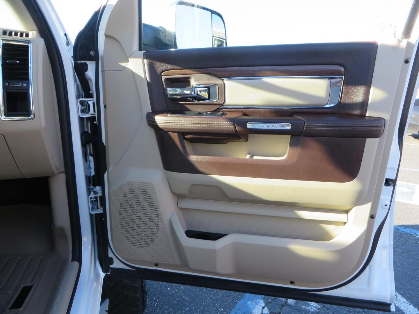 2015 White /Tan RAM 2500 Laramie Crew Cab LWB 4WD (3C6UR5KLXFG) with an 6.7L L6 OHV 24V TURBO DIESEL engine, 6-Speed Automatic transmission, located at 2630 Grass Valley Highway, Auburn, CA, 95603, (530) 508-5100, 38.937893, -121.095482 - Features- Thuren Suspension system, Fox 2.5 Performance Elite shocks, N-Fab runnign boards, Rimrock rear bumper, 20'' Fuel wheels, 35'' Nito Trail Grappler tires, Weathertech floor liners, and a Banks intake. - Photo#56