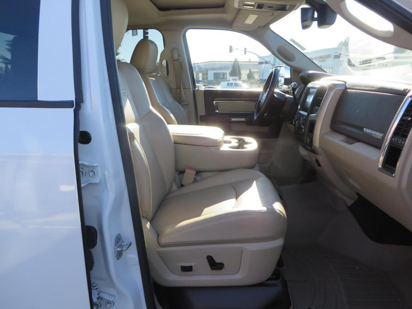 2015 White /Tan RAM 2500 Laramie Crew Cab LWB 4WD (3C6UR5KLXFG) with an 6.7L L6 OHV 24V TURBO DIESEL engine, 6-Speed Automatic transmission, located at 2630 Grass Valley Highway, Auburn, CA, 95603, (530) 508-5100, 38.937893, -121.095482 - Features- Thuren Suspension system, Fox 2.5 Performance Elite shocks, N-Fab runnign boards, Rimrock rear bumper, 20'' Fuel wheels, 35'' Nito Trail Grappler tires, Weathertech floor liners, and a Banks intake. - Photo#58