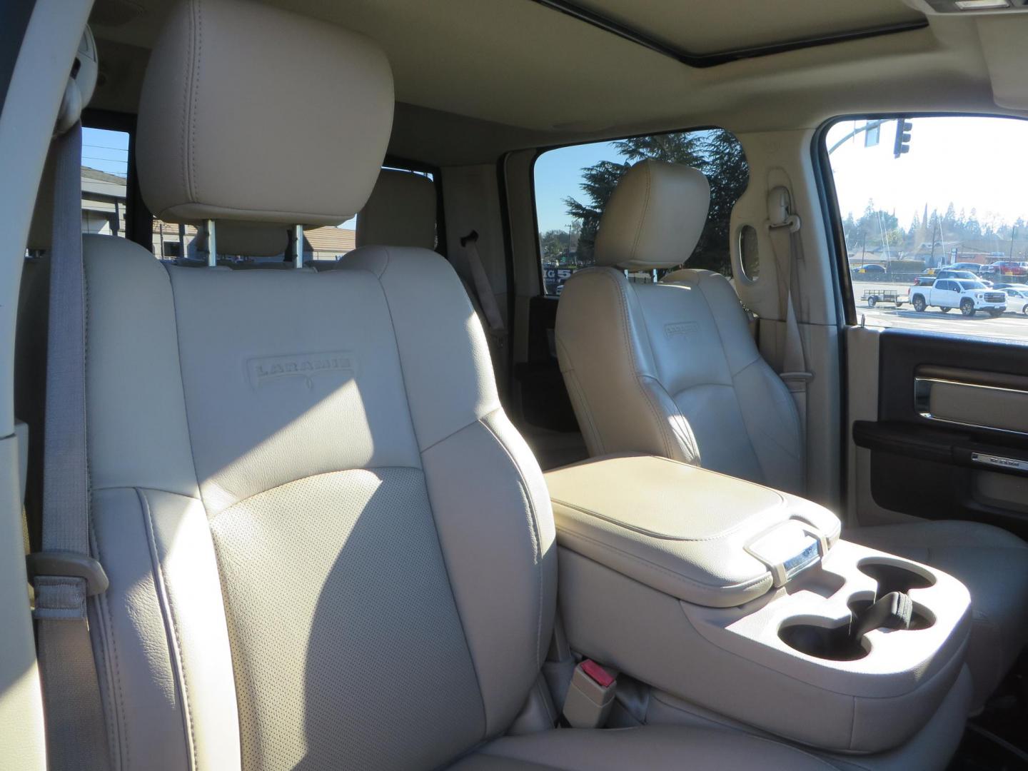 2015 White /Tan RAM 2500 Laramie Crew Cab LWB 4WD (3C6UR5KLXFG) with an 6.7L L6 OHV 24V TURBO DIESEL engine, 6-Speed Automatic transmission, located at 2630 Grass Valley Highway, Auburn, CA, 95603, (530) 508-5100, 38.937893, -121.095482 - Features- Thuren Suspension system, Fox 2.5 Performance Elite shocks, N-Fab runnign boards, Rimrock rear bumper, 20'' Fuel wheels, 35'' Nito Trail Grappler tires, Weathertech floor liners, and a Banks intake. - Photo#59