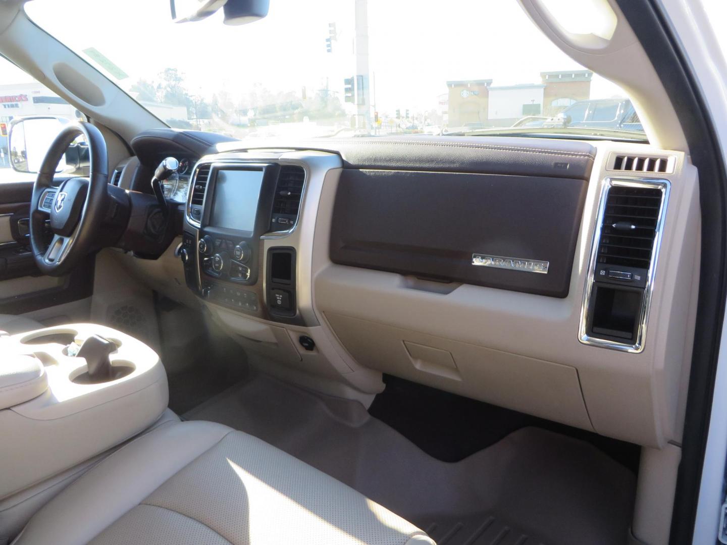 2015 White /Tan RAM 2500 Laramie Crew Cab LWB 4WD (3C6UR5KLXFG) with an 6.7L L6 OHV 24V TURBO DIESEL engine, 6-Speed Automatic transmission, located at 2630 Grass Valley Highway, Auburn, CA, 95603, (530) 508-5100, 38.937893, -121.095482 - Features- Thuren Suspension system, Fox 2.5 Performance Elite shocks, N-Fab runnign boards, Rimrock rear bumper, 20'' Fuel wheels, 35'' Nito Trail Grappler tires, Weathertech floor liners, and a Banks intake. - Photo#61