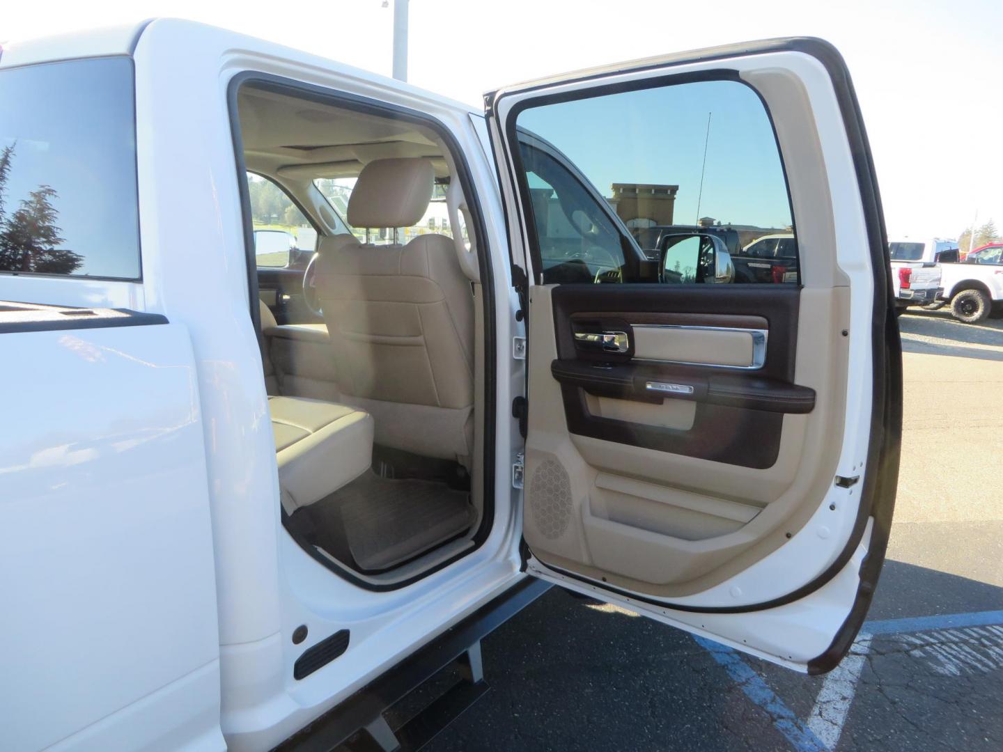 2015 White /Tan RAM 2500 Laramie Crew Cab LWB 4WD (3C6UR5KLXFG) with an 6.7L L6 OHV 24V TURBO DIESEL engine, 6-Speed Automatic transmission, located at 2630 Grass Valley Highway, Auburn, CA, 95603, (530) 508-5100, 38.937893, -121.095482 - Features- Thuren Suspension system, Fox 2.5 Performance Elite shocks, N-Fab runnign boards, Rimrock rear bumper, 20'' Fuel wheels, 35'' Nito Trail Grappler tires, Weathertech floor liners, and a Banks intake. - Photo#62