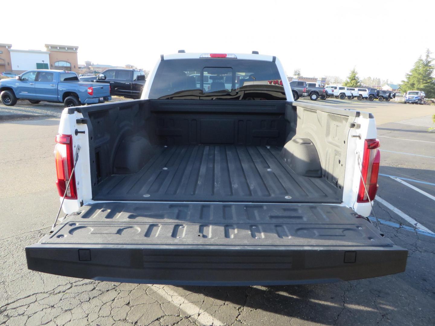 2024 White Ford F-150 Lariat SuperCrew 4WD (1FTFW5L56RF) with an 5.0L V8 OHV 16V engine, 6A transmission, located at 2630 Grass Valley Highway, Auburn, CA, 95603, (530) 508-5100, 38.937893, -121.095482 - New Level kit, 20'' Gear Alloy 764BM wheels, and Toyo Open Country AT3 tires. - Photo#12